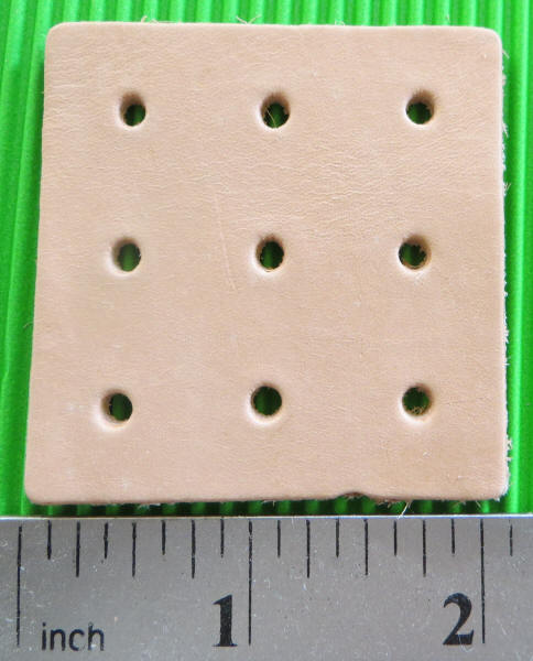 1.75" x 1.75 with (9) 1/8" holes